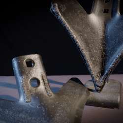 Posed Caden Edge sweeps with a black background to show off the underside and the top of the sweep.